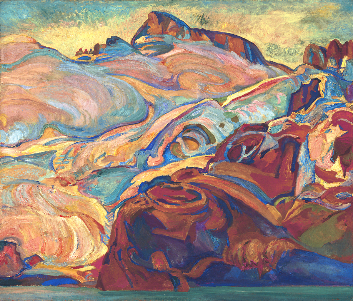Oil painting of mountains in bright and pastel shades of blue, yellow, red, green, orange. A narrow band of blue water at the bottom of the painting and blue sky with clouds at the top.