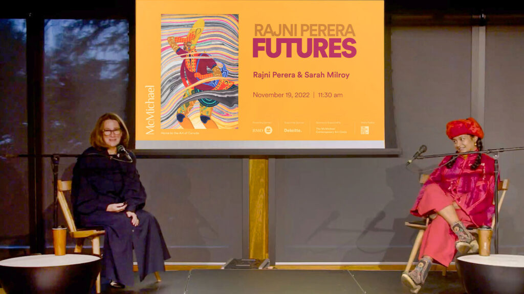 Sarah and Rajni during a talk