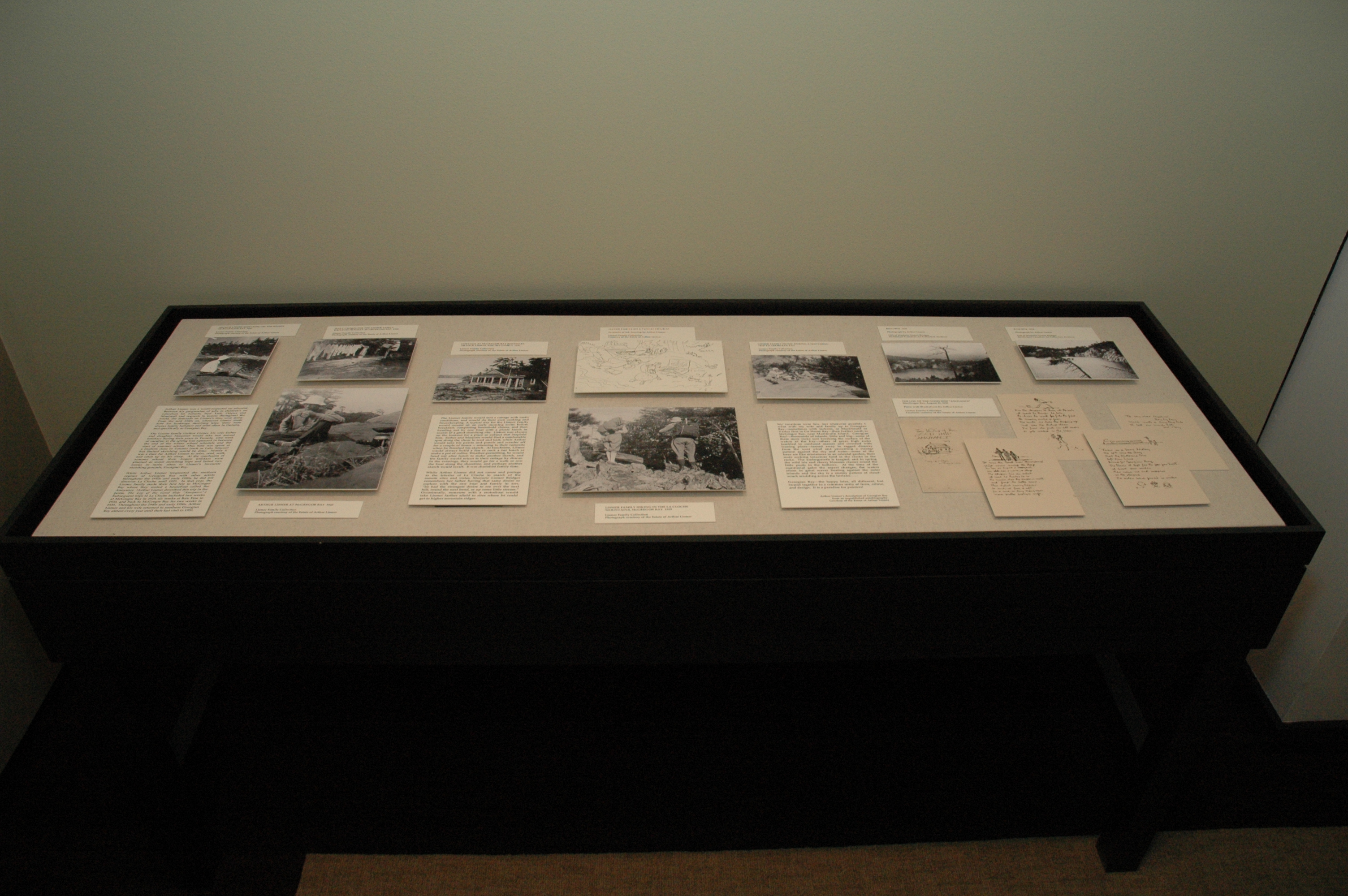 black and white photograph of a display case containing printed material