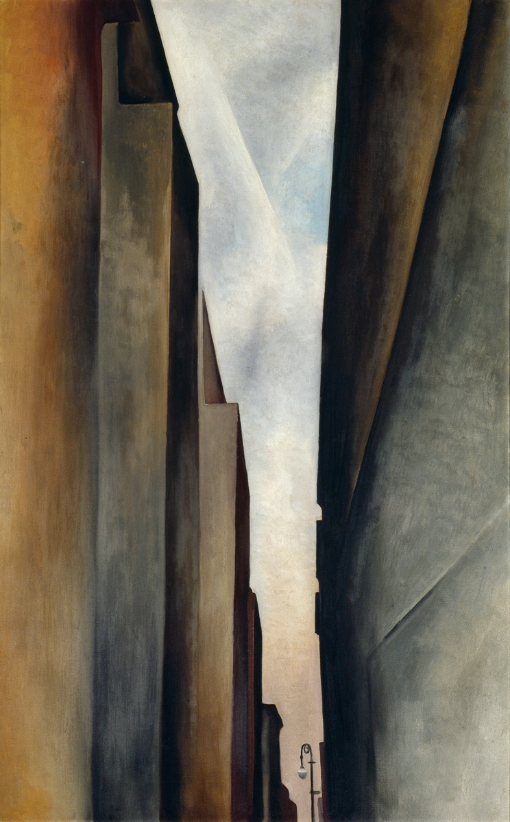 Painting of a very narrow urban street in an abstract style with towering buildings on either side in shades of grey to black and light to dark brown. Old-fashioned black lamp post one eighth of the height of the painting at bottom of wedge-shaped opening between buildings is silhouetted against a sandy coloured ground that changes to white and pale blue as it reaches the top of the painting.
